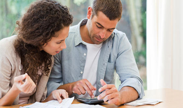 couple working with calculator